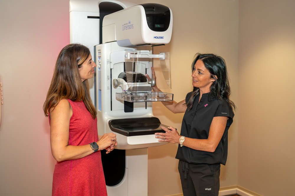 Lacey Foley Talks to Patient about Mammogram Process.jpg