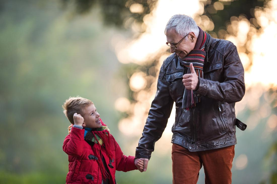 Grandfather taking a walk with his grandson.jpg