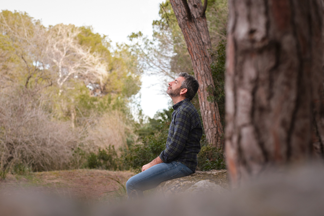 Man sitting outside breathing fresh air.jpg
