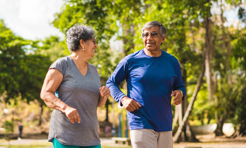 Happy senior couple walking outside.jpg