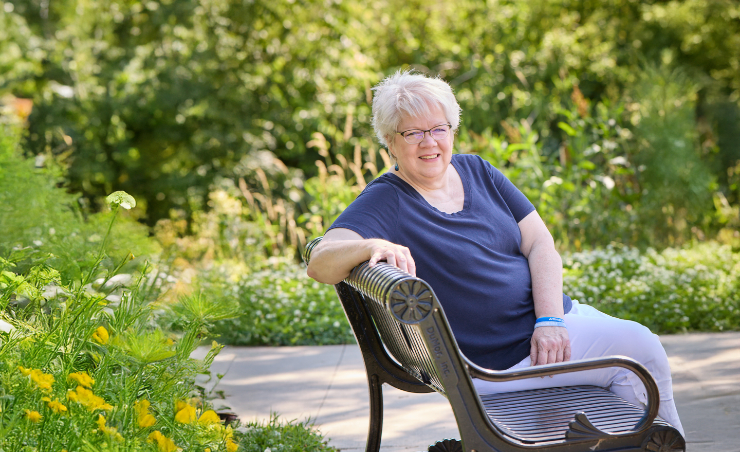 Sally Robinson Sitting on Bench in Park.jpg