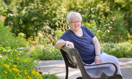 Sally Robinson Sitting on Bench in Park.jpg