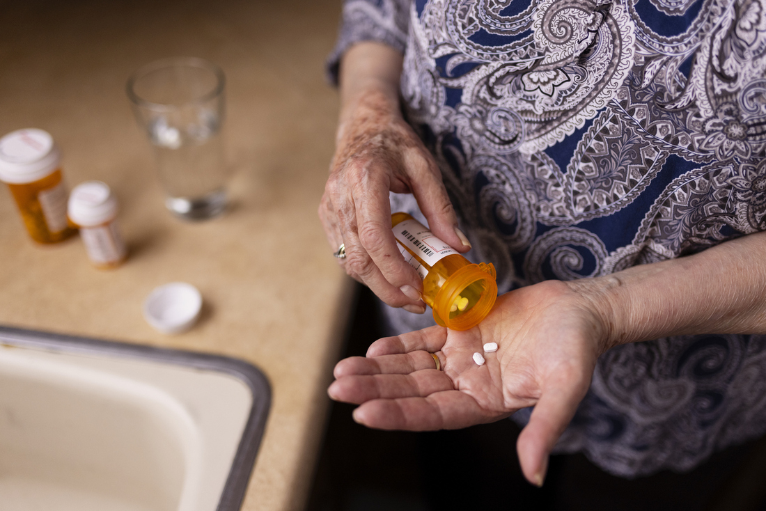 Woman taking prescription pills.jpg