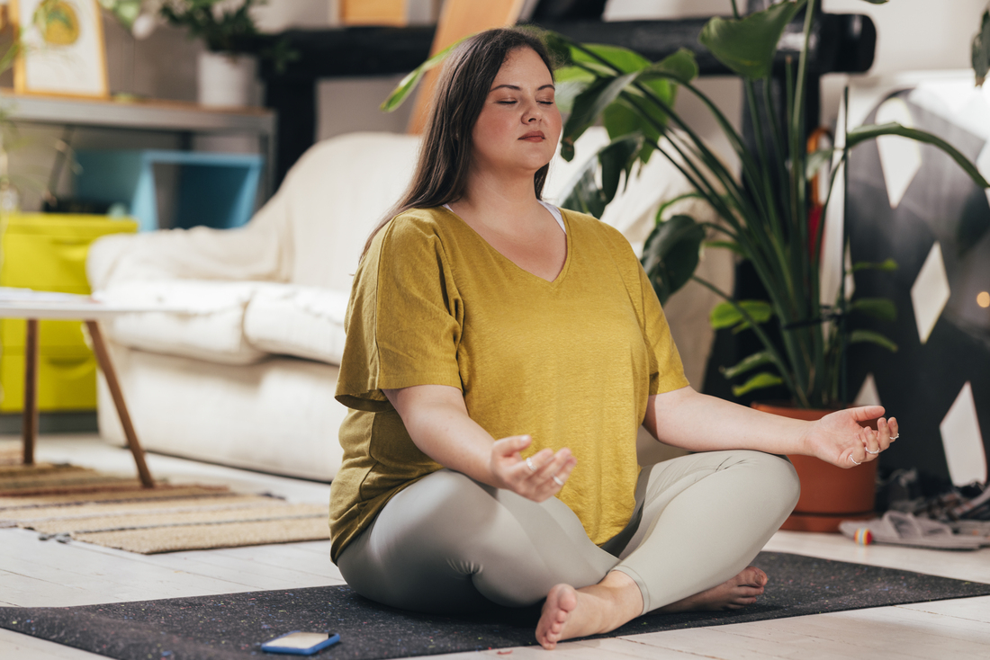 Woman siting on floor meditating