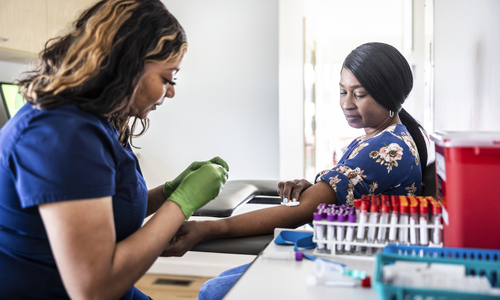 Patient giving blood sample at lab.jpg