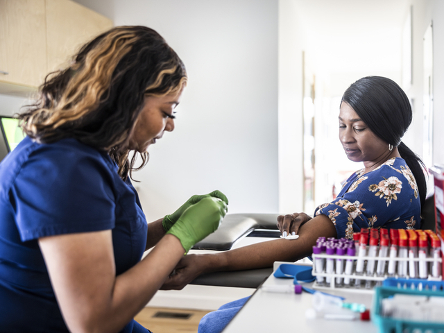 Patient giving blood sample at lab.jpg