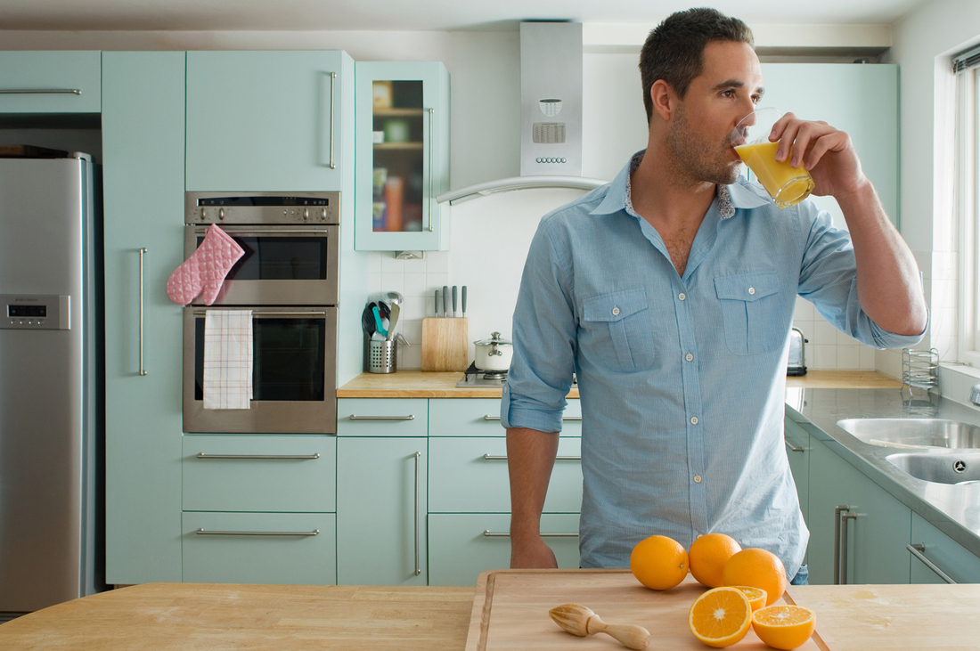 Man drinking orange juice.jpg