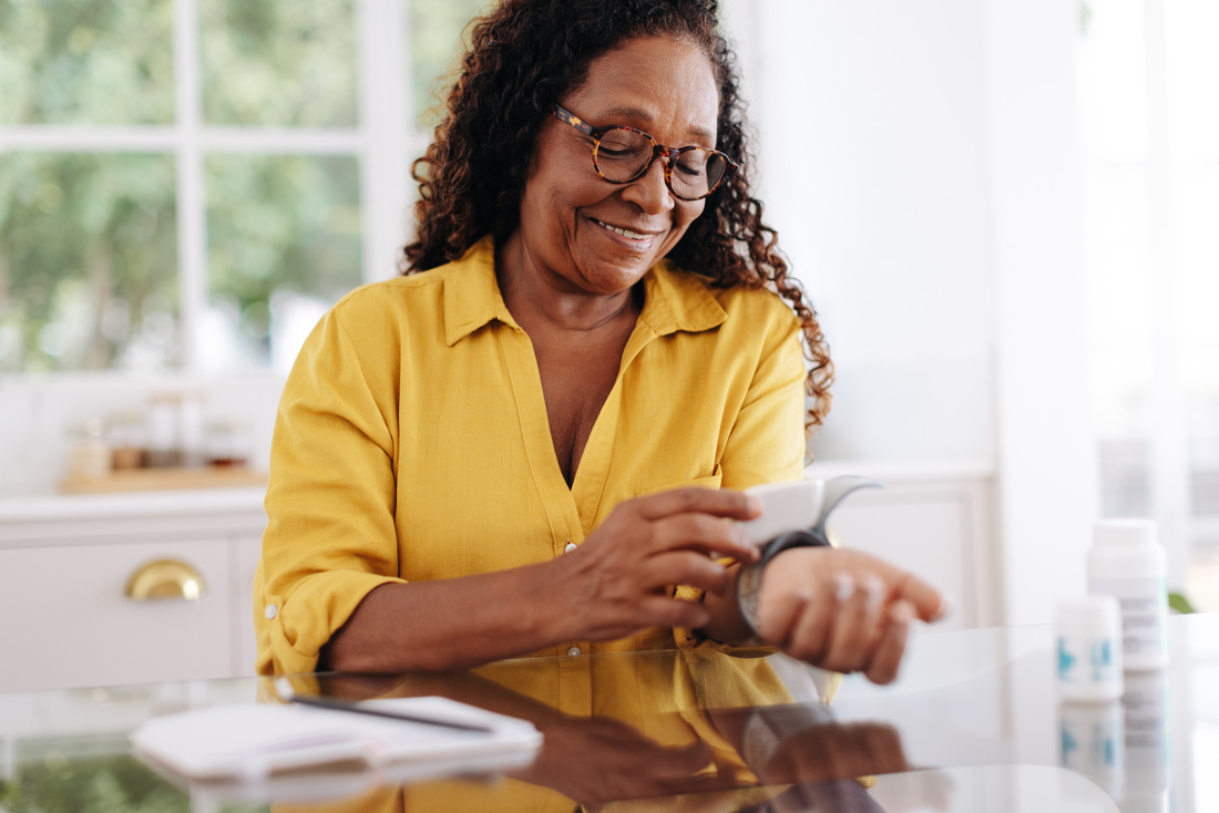 Woman checking blood pressure.jpg