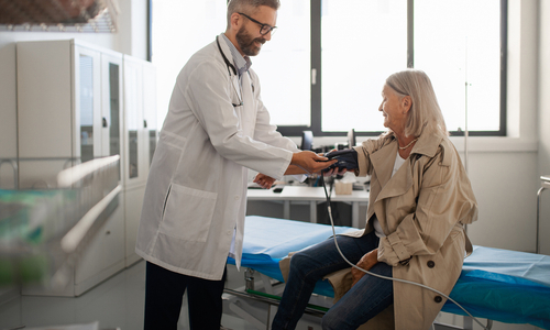 Doctor doing blood pressure check.jpg