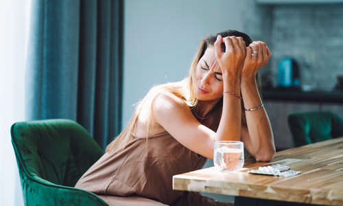 Man with headache holding head in pain.jpg