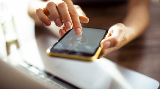 Person scrolling their cell phone