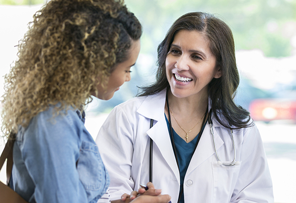 Doctor talking to woman