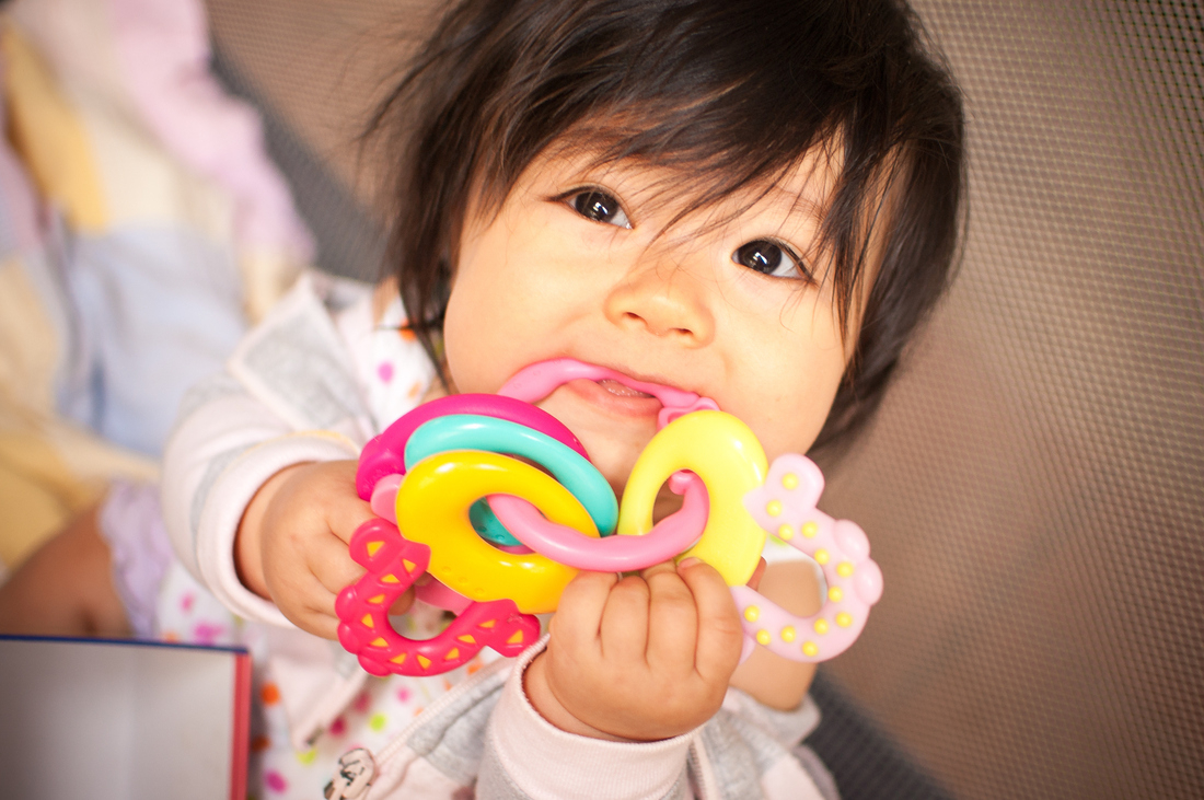 Baby chewing on toy.jpg