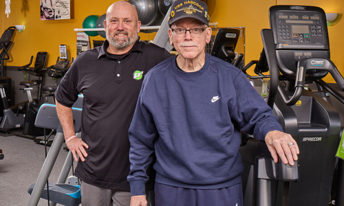 Kurt and Allen Buck standing in room of fitness equiment.jpg
