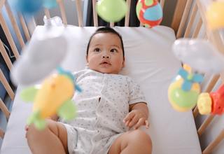 5 month old looking at mobile.jpg