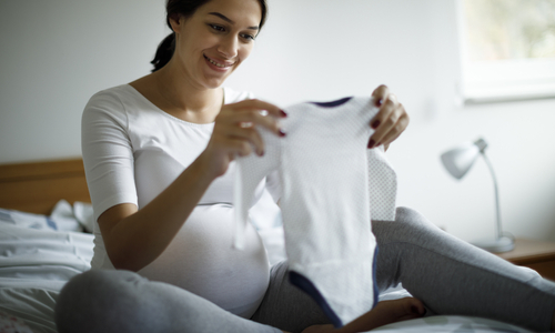 Pregnant mom packing hospital bag.jpg