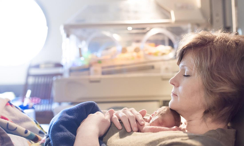 Mom holding baby in NICU.jpg