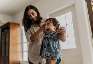 12 month old walking with assistance.jpg