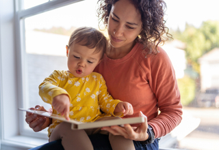 18 month old pointing in book.jpg
