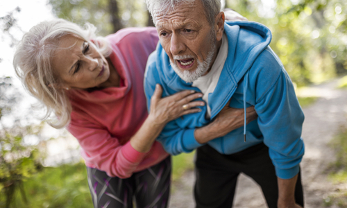 Male holding onto chest bending over.jpg