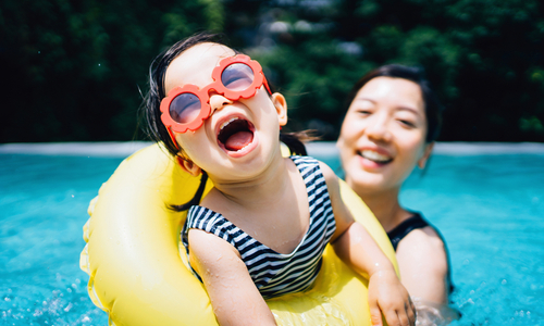 Child swimming with mom.jpg
