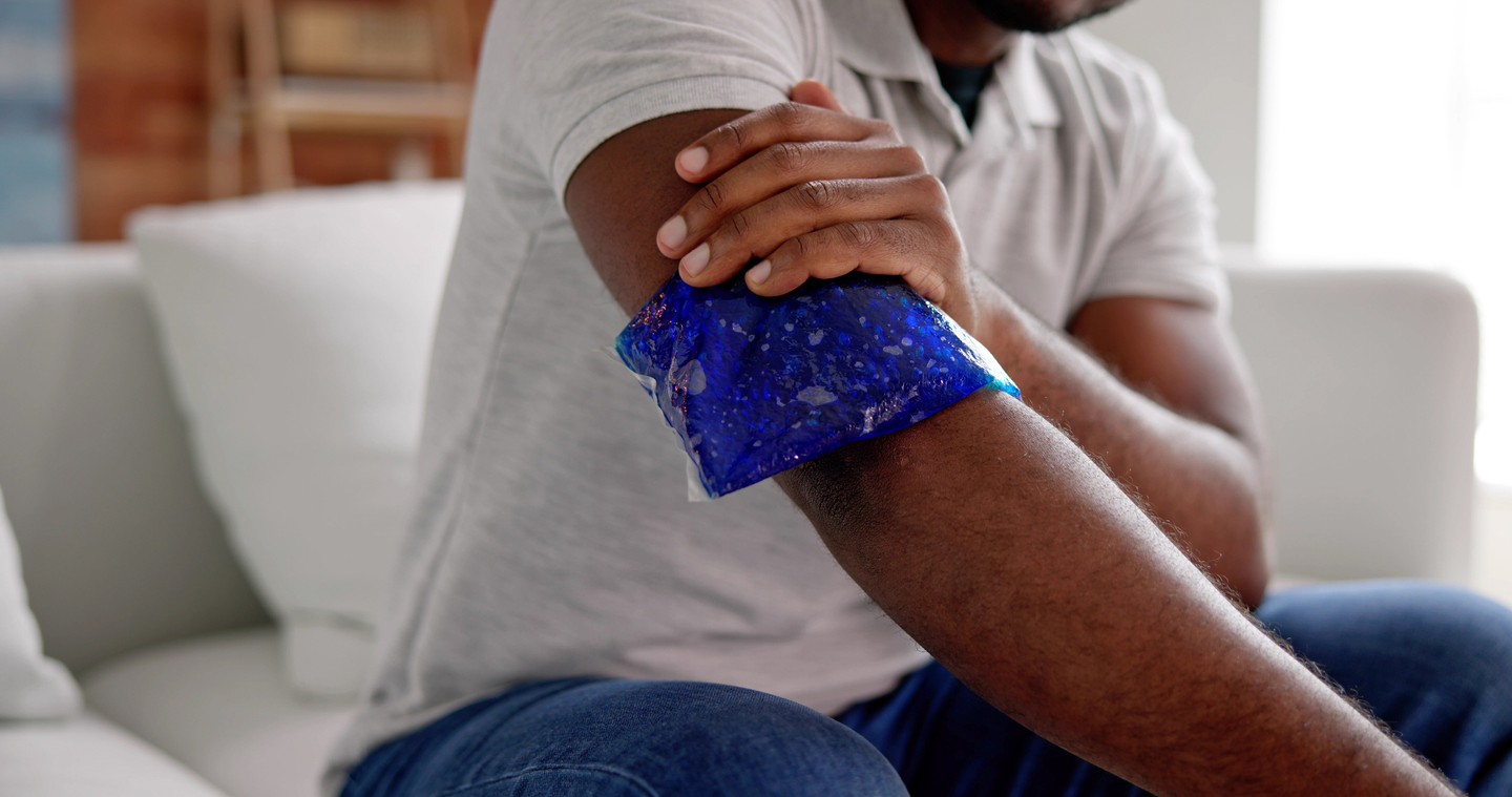 Man holding ice pack on arm.jpg