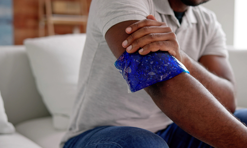 Man holding ice pack on arm.jpg