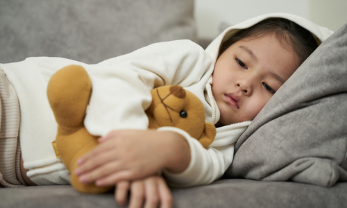 Sick toddler lying on couch.jpg