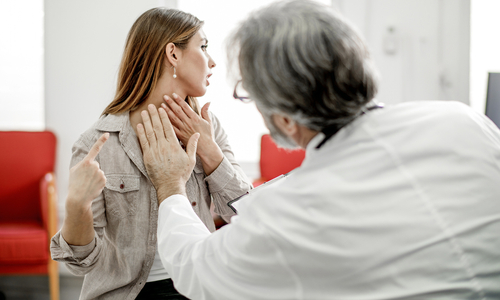 Doctor feeling patient lyph nodes on neck.jpg