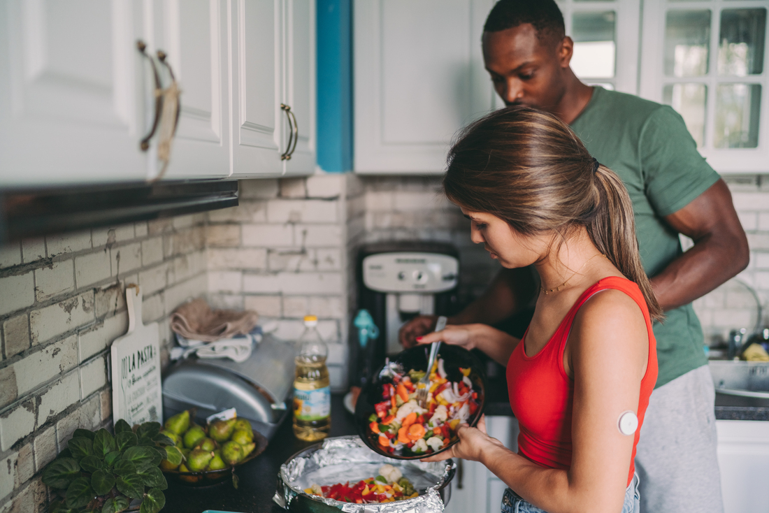 Man and woman in kitchen cooking