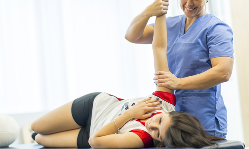 Woman with therapist shoulder pain.jpg