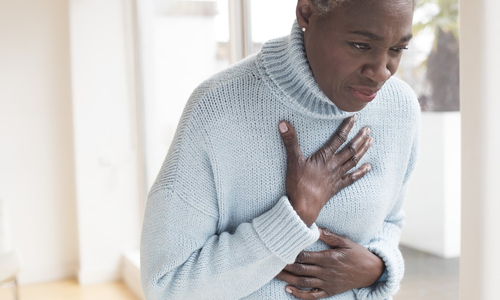 Woman holding hands to chest.jpg