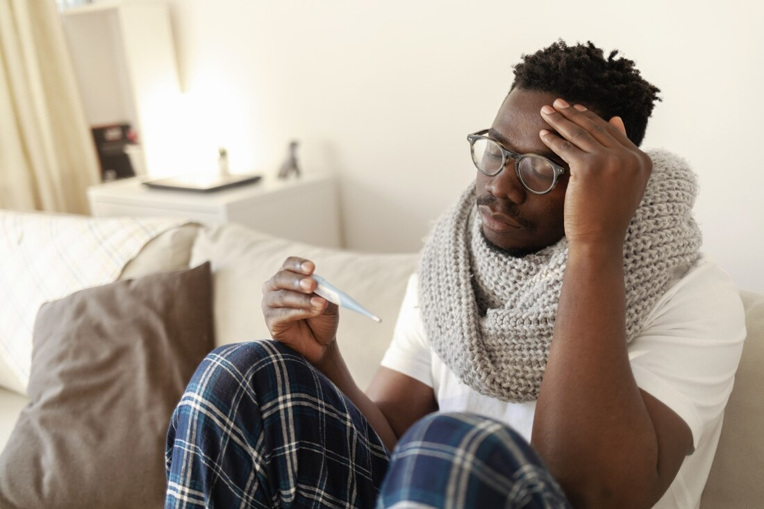 Man sick with fever.jpg