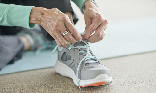 Women putting on shoe.jpg