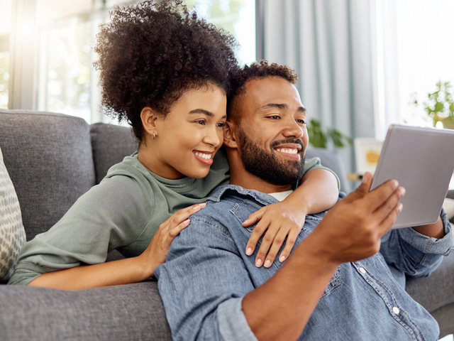 Happy couple with tablet computer.jpg