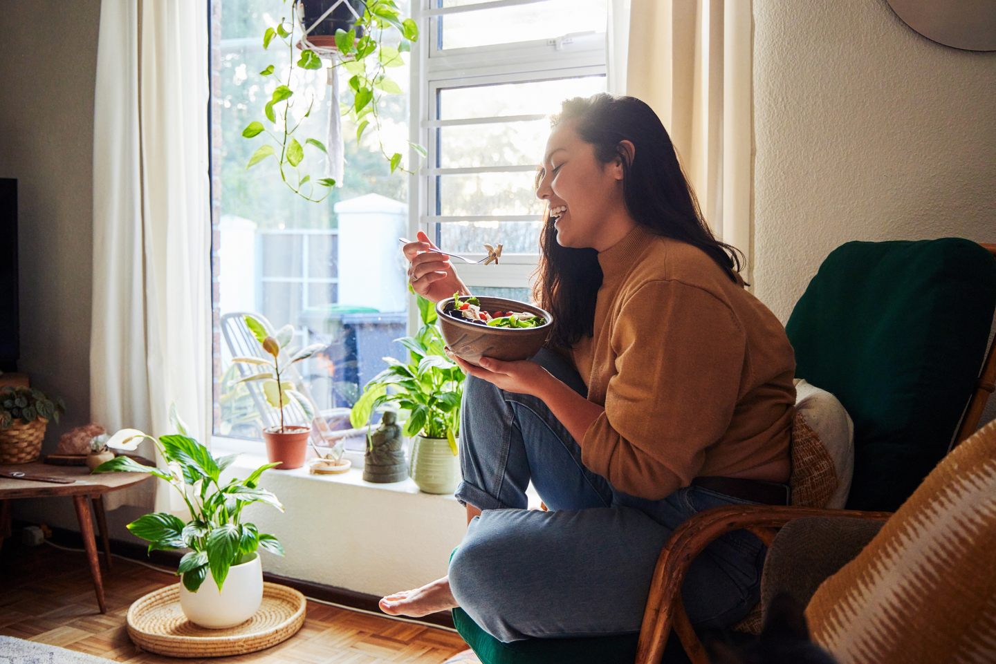 Woman eating on couch.jpg