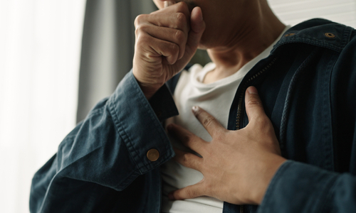 Woman covering mouth with hands.jpg