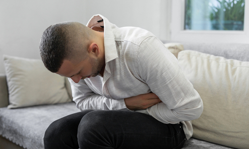 Man holding stomach.jpg