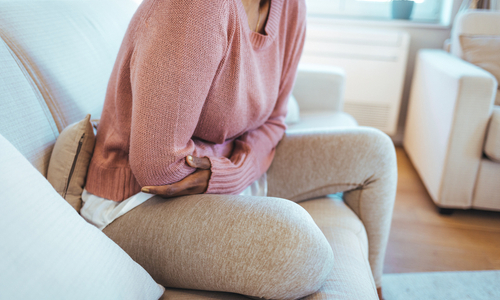 Woman sick upset stomach.jpg