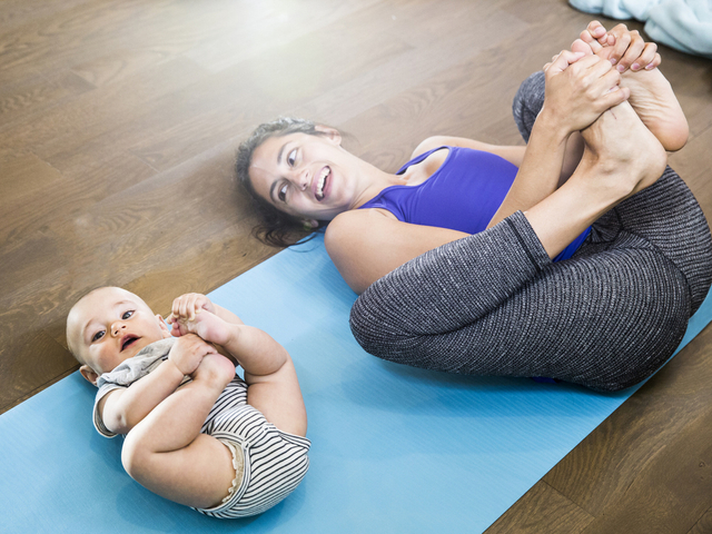 Postpartum mom exercising with newborn.jpg