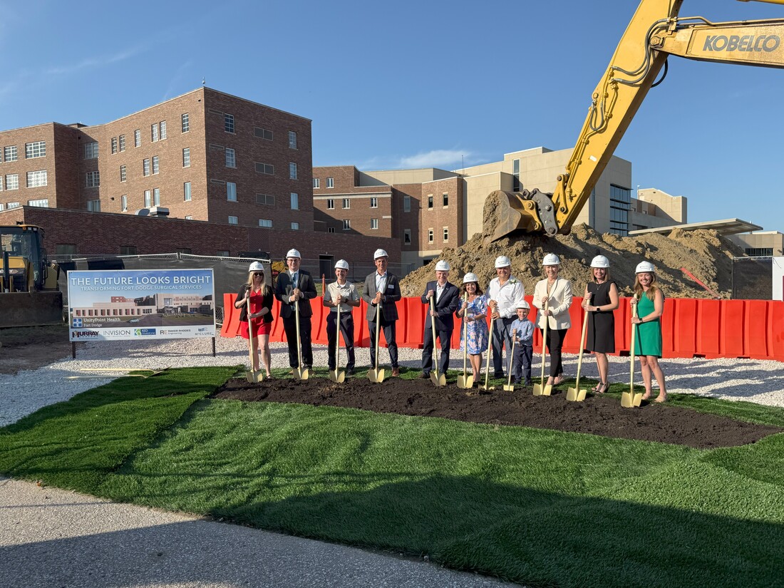 Team posing with shovels in front of facility exterior construction - Fort Dodge Surgery Renovation.jpg