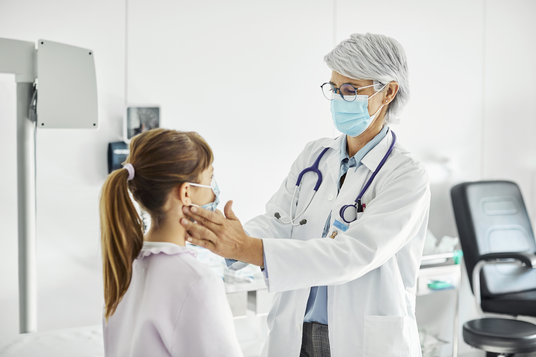 Doctor feeling patient lymph nodes