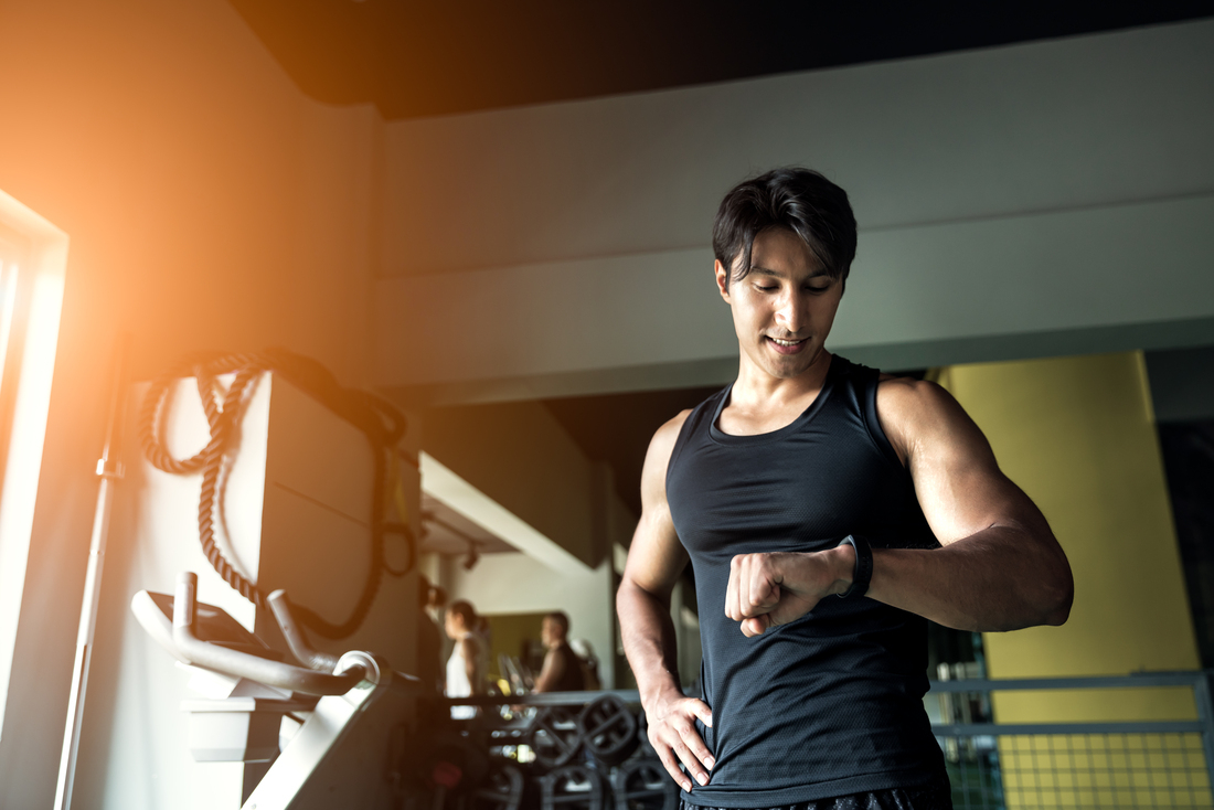man looking at fitness tracker device.jpg