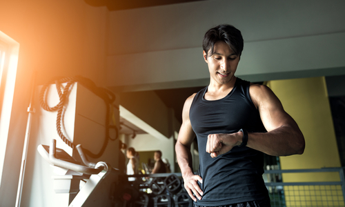 man looking at fitness tracker device.jpg