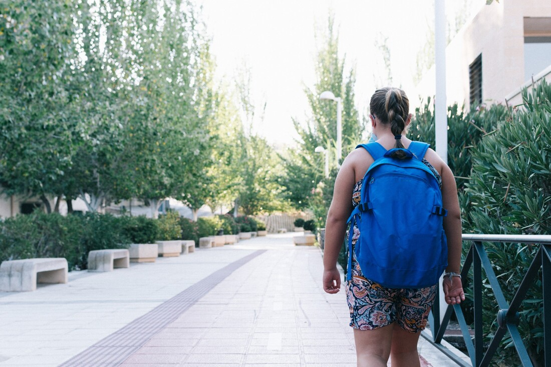 Overweight obese child walking down sidewalk.jpg