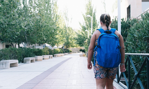 Overweight obese child walking down sidewalk.jpg