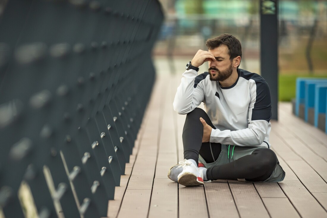 Man holding shoulder in pain.jpg