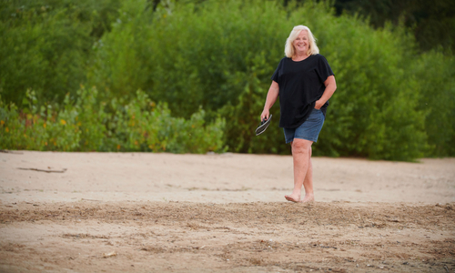 Jodi Doty walking on beach.jpg