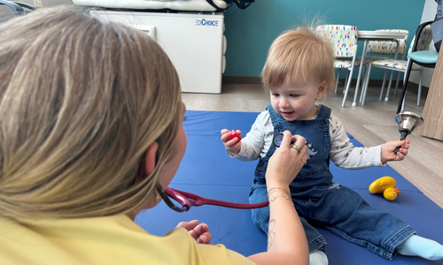 Provider listening to child's heart