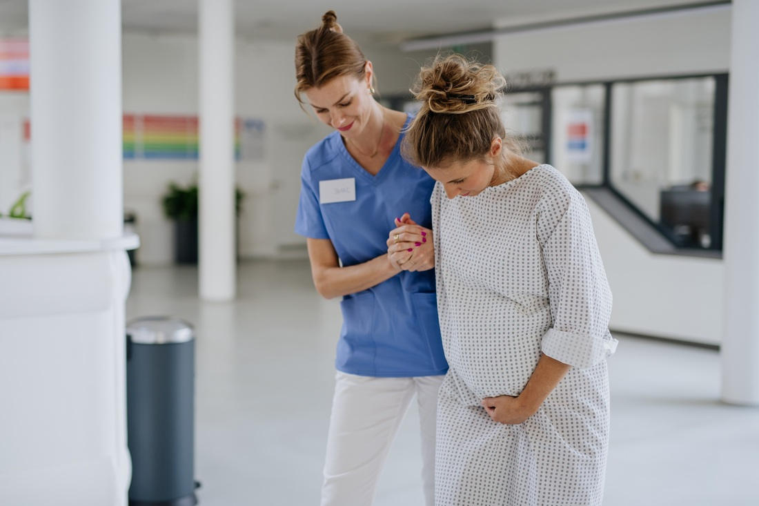 Nurse walking with pregnant patient.jpg
